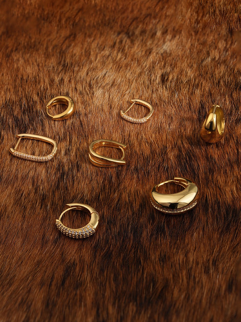 Ovale Huggie Hoops Ohrringe Gold Silber